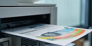 Photocopier in action making black and colour copies